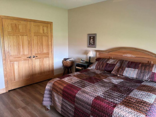 bedroom with dark wood-style floors