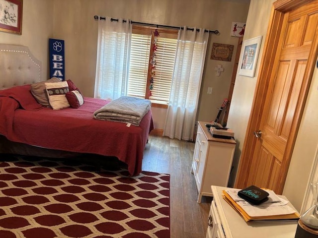 bedroom with hardwood / wood-style flooring