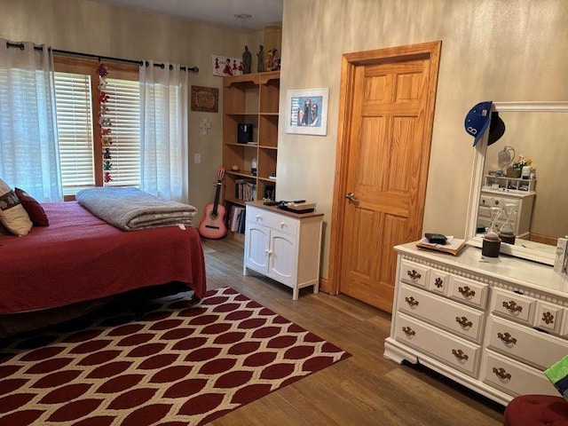 bedroom featuring dark wood-style floors