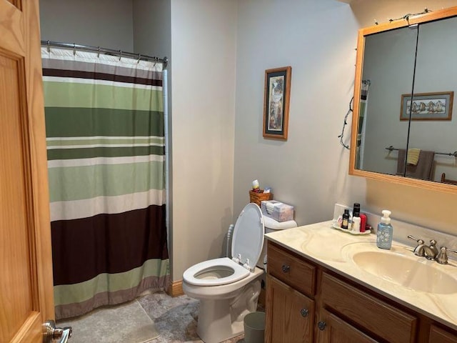 bathroom with a shower with shower curtain, toilet, and vanity