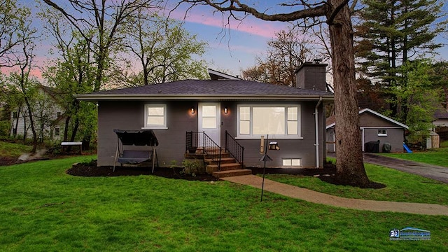 view of front of property with a chimney and a front yard