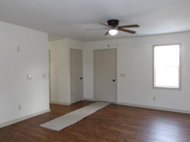 908 Merrill Ave, Loves Park, IL 61111 - empty room with wood finished floors, a ceiling fan, and baseboards