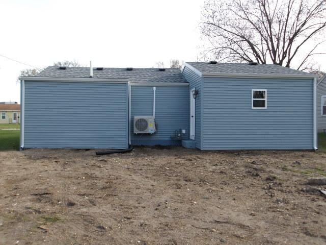 908 Merrill Ave, Loves Park, IL 61111 - rear view of house with ac unit and roof with shingles