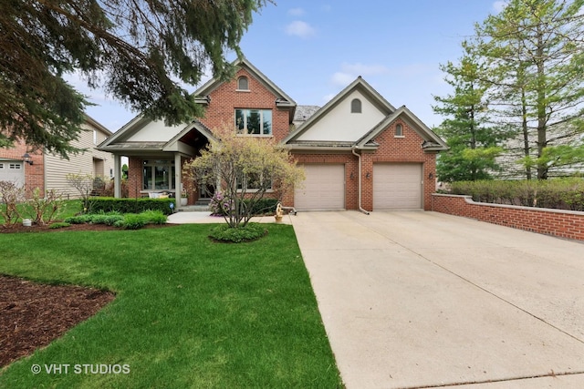 21819 W Riviera Ct, Mundelein, IL 60060 - view of front of house featuring concrete driveway, brick siding, an attached garage, and a front lawn