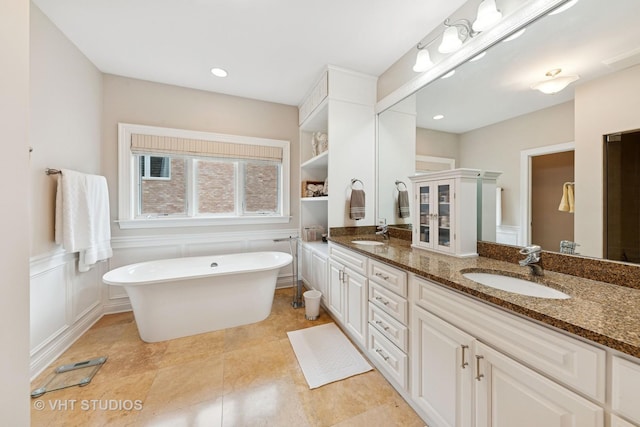 21819 W Riviera Ct, Mundelein, IL 60060 - full bath with recessed lighting, a soaking tub, double vanity, and a sink