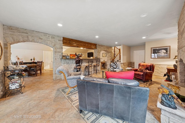 21819 W Riviera Ct, Mundelein, IL 60060 - living room with stairway, arched walkways, and recessed lighting