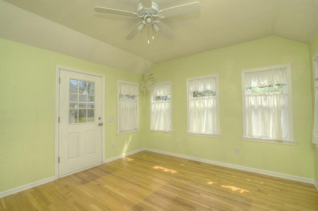 2816 Stilling Blvd, Mchenry, IL 60050 - unfurnished room with lofted ceiling, a ceiling fan, light wood finished floors, and baseboards