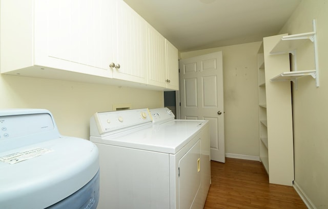 2816 Stilling Blvd, Mchenry, IL 60050 - washroom with washing machine and clothes dryer, wood finished floors, cabinet space, and baseboards