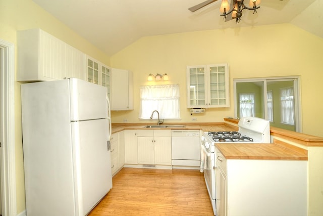 2816 Stilling Blvd, Mchenry, IL 60050 - kitchen featuring white appliances, lofted ceiling, butcher block countertops, a sink, and a peninsula