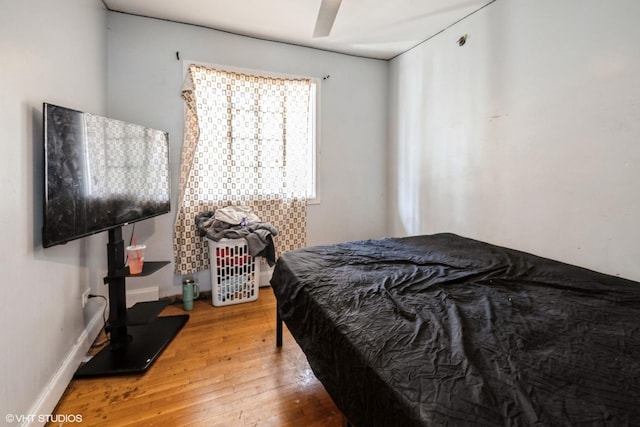 bedroom with wood-type flooring
