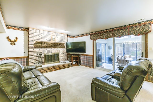 1127 Alpine Ln, Lemont, IL 60439 - carpeted living area with visible vents, a wainscoted wall, a healthy amount of sunlight, and a fireplace