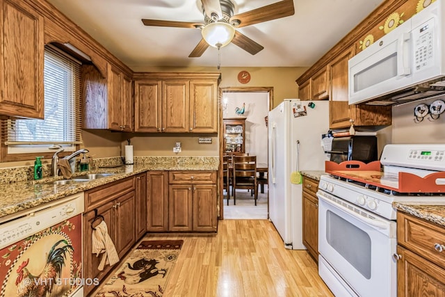 1127 Alpine Ln, Lemont, IL 60439 - kitchen featuring brown cabinets, a sink, white appliances, a ceiling fan, and light wood-type flooring
