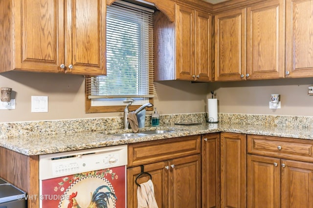 1127 Alpine Ln, Lemont, IL 60439 - kitchen with light stone counters, brown cabinetry, a sink, and dishwasher