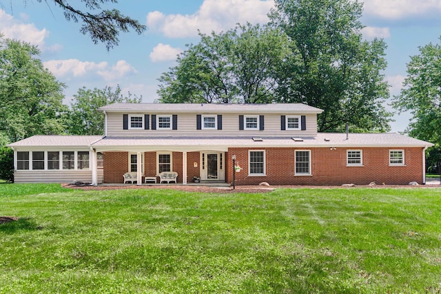2S739 Nelson Lake Rd, Batavia, IL 60510 - view of front of home with a front lawn, a sunroom, and brick siding