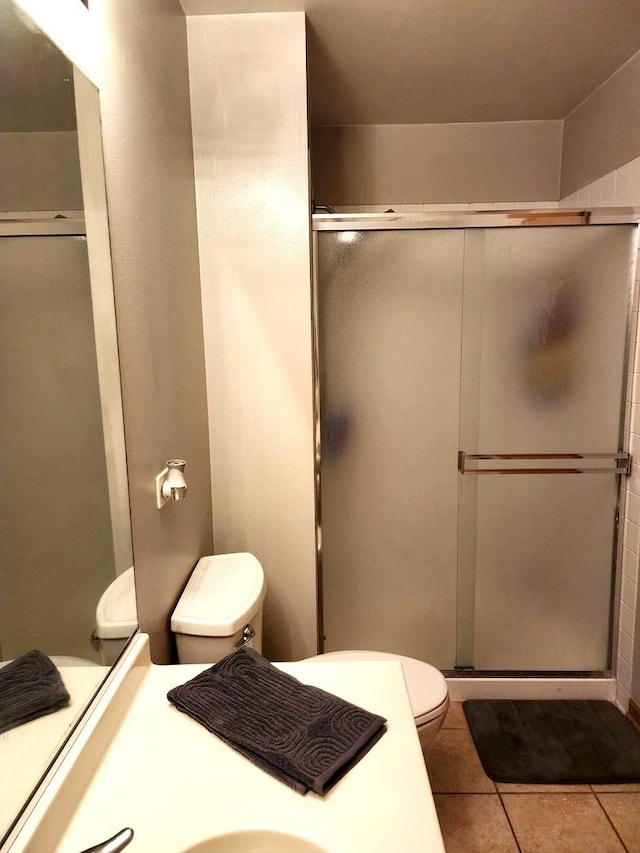 119 Oak Knoll Ct, Volo, IL 60020 - bathroom featuring toilet, a shower stall, tile patterned floors, and vanity