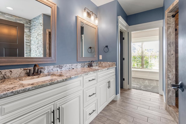 1101 Cascade Dr, Savoy, IL 61874 - bathroom with double vanity and wood finished floors