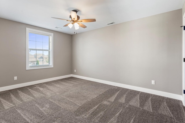 1101 Cascade Dr, Savoy, IL 61874 - carpeted spare room with a ceiling fan and baseboards