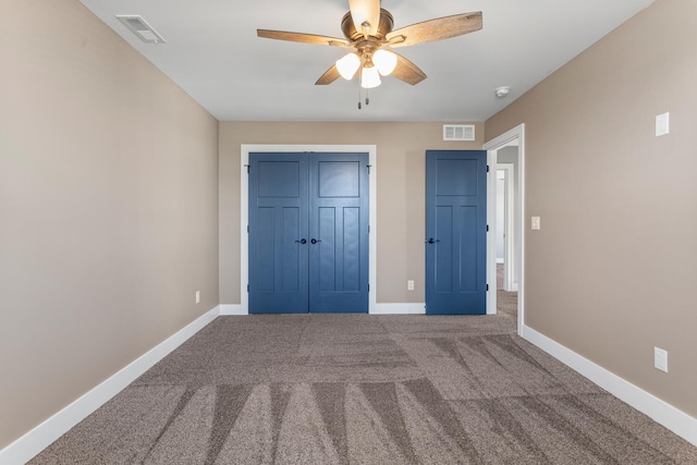 1101 Cascade Dr, Savoy, IL 61874 - unfurnished bedroom with carpet, a closet, and a ceiling fan