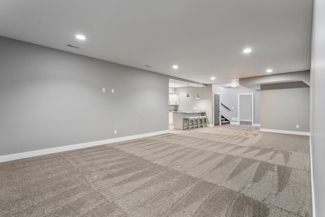 1101 Cascade Dr, Savoy, IL 61874 - finished basement with light colored carpet, recessed lighting, and stairway