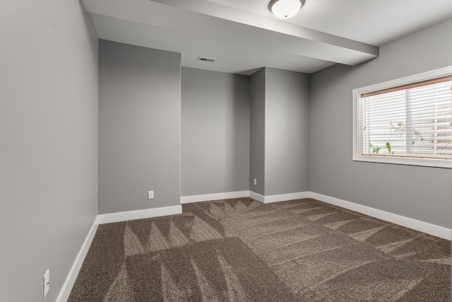 1101 Cascade Dr, Savoy, IL 61874 - empty room featuring dark colored carpet and baseboards