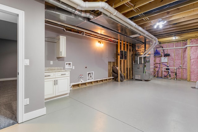 1101 Cascade Dr, Savoy, IL 61874 - unfinished below grade area with baseboards and heating unit