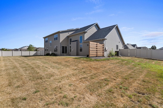 1101 Cascade Dr, Savoy, IL 61874 - rear view of property featuring a fenced backyard, a patio, and a gate