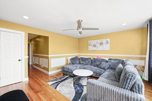 living area featuring baseboards, recessed lighting, ceiling fan, and wood finished floors