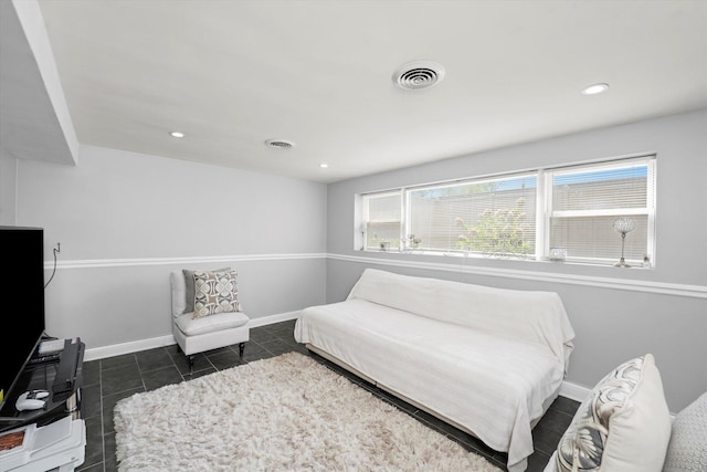 bedroom with visible vents, recessed lighting, baseboards, and dark tile patterned flooring