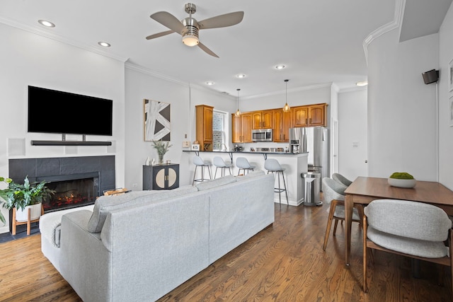 1942 W Armitage Ave Unit 2, Chicago, IL 60622 - living area with ceiling fan, dark wood-style floors, recessed lighting, crown molding, and a tiled fireplace