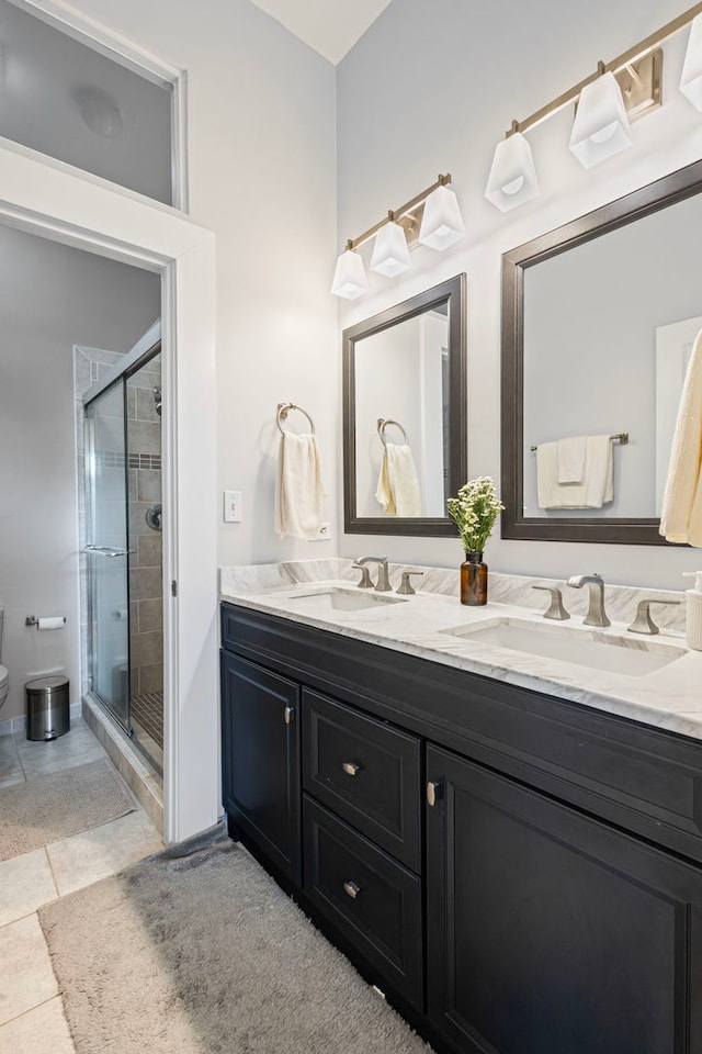 1942 W Armitage Ave Unit 2, Chicago, IL 60622 - full bathroom with double vanity, a stall shower, and tile patterned floors