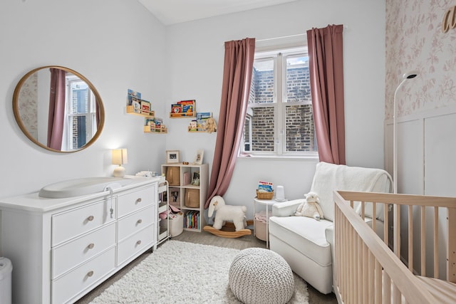1942 W Armitage Ave Unit 2, Chicago, IL 60622 - bedroom featuring a crib and wallpapered walls