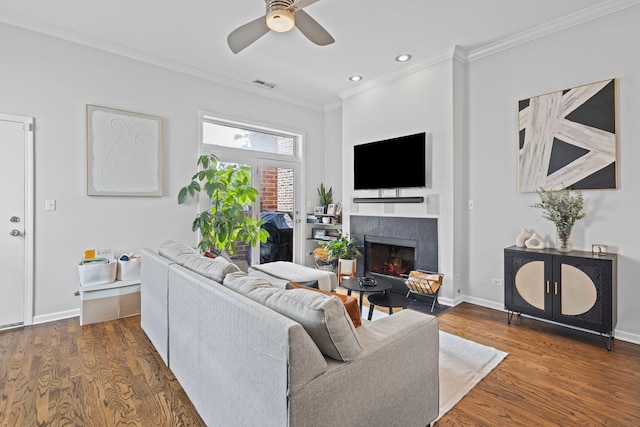 1942 W Armitage Ave Unit 2, Chicago, IL 60622 - living room featuring ornamental molding, a tiled fireplace, ceiling fan, dark wood-style flooring, and recessed lighting