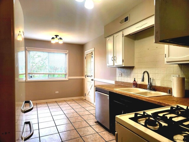 kitchen with dishwasher, a sink, white range with gas stovetop, white cabinets, and tasteful backsplash