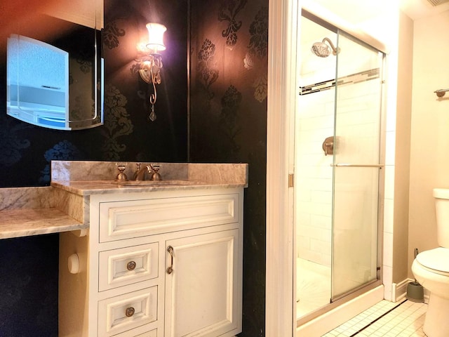 full bath featuring toilet, a shower stall, tile patterned floors, and vanity