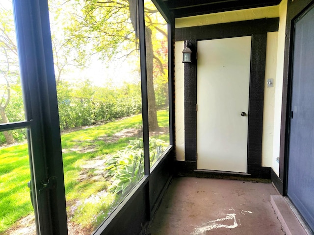 unfurnished sunroom featuring healthy amount of natural light