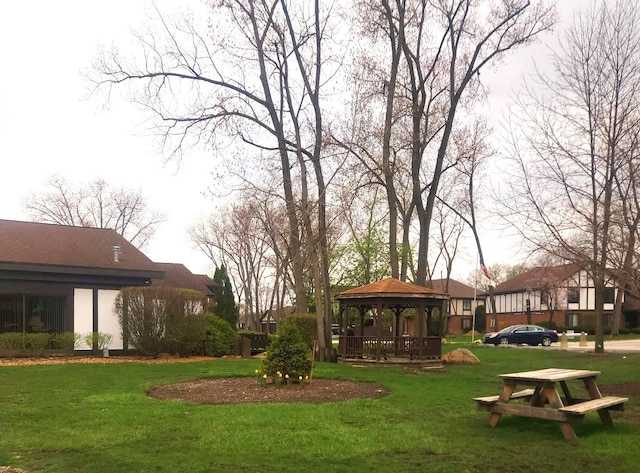 surrounding community featuring a gazebo and a yard