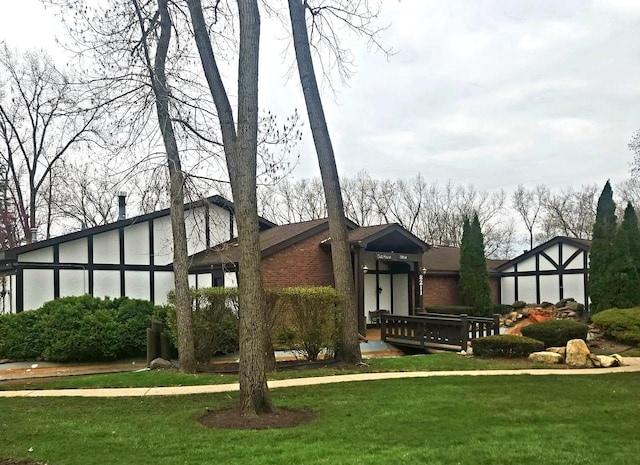 rear view of property featuring a yard