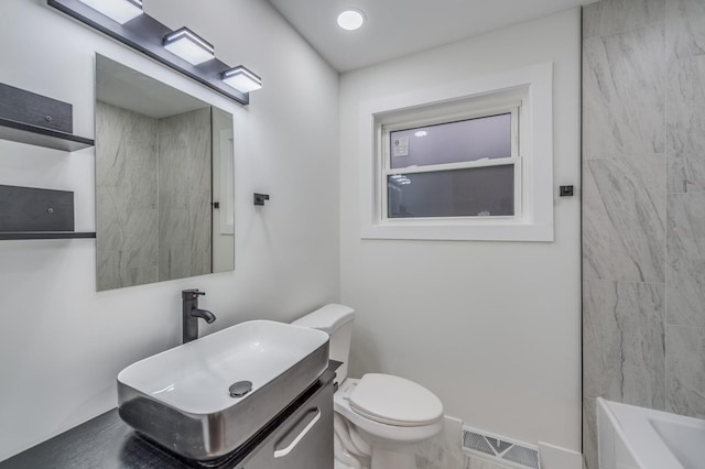 bathroom featuring toilet, visible vents, a bathing tub, a shower, and vanity