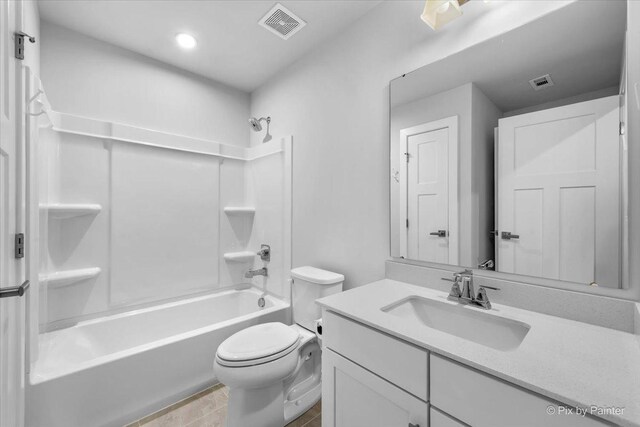 full bathroom featuring shower / bathtub combination, visible vents, vanity, and toilet