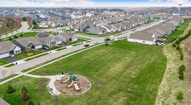 birds eye view of property with a residential view