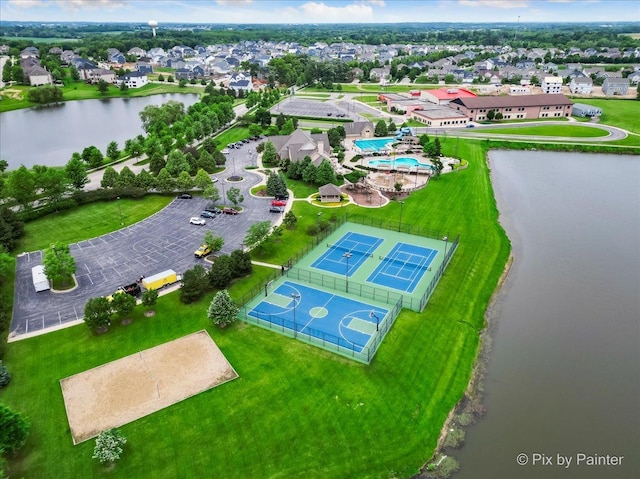 drone / aerial view with a water view and a residential view