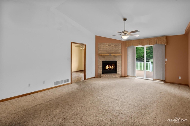 1231 Anthony Ln, Sandwich, IL 60548 - unfurnished living room with carpet floors, ceiling fan, vaulted ceiling, a brick fireplace, and baseboards
