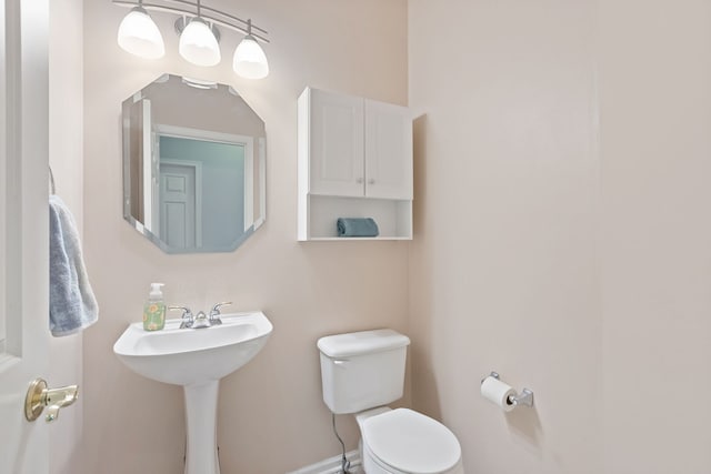 bathroom featuring a sink and toilet
