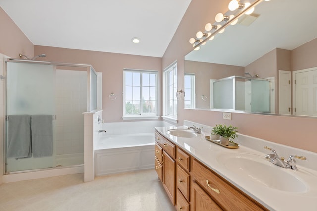 full bath featuring a sink, a bath, a stall shower, and vaulted ceiling