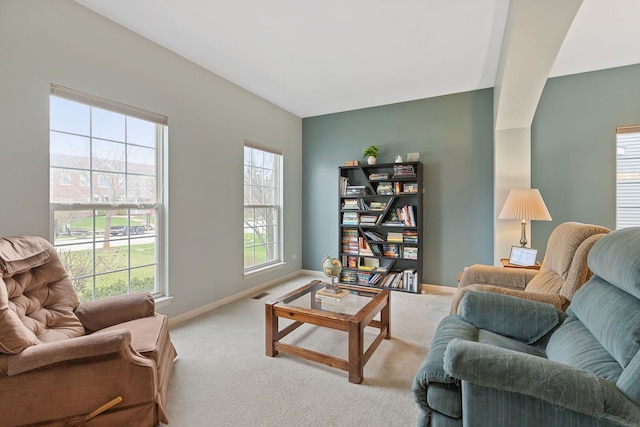 carpeted living room featuring baseboards and visible vents