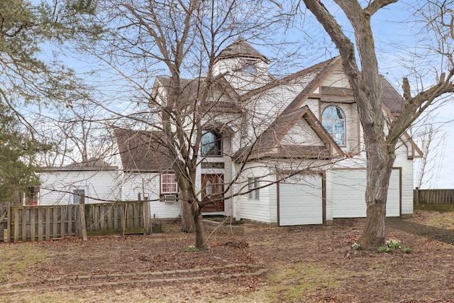 view of front of home featuring fence