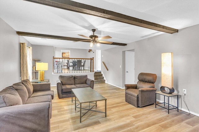 3104 Park Haven Blvd, Danville, IL 61832 - living room featuring beam ceiling, stairs, light wood-type flooring, a ceiling fan, and baseboards