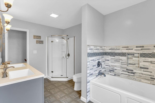 3104 Park Haven Blvd, Danville, IL 61832 - full bathroom featuring a shower stall, toilet, a garden tub, and double vanity