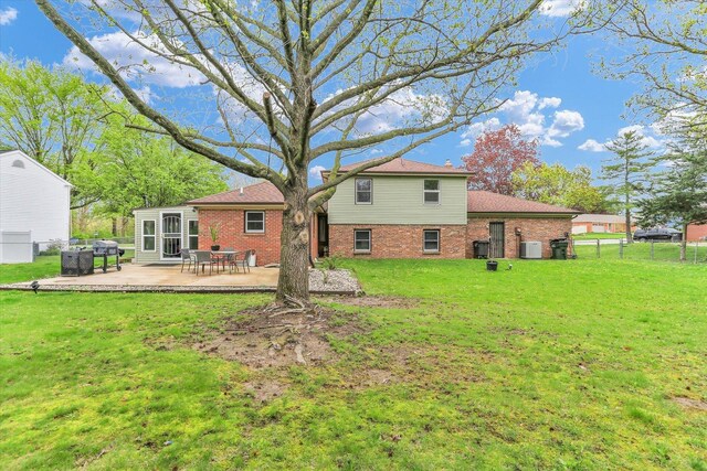 3104 Park Haven Blvd, Danville, IL 61832 - back of property featuring brick siding and a patio
