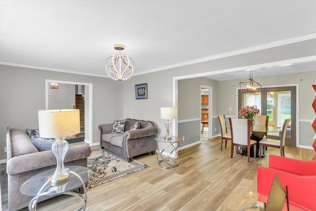 3104 Park Haven Blvd, Danville, IL 61832 - living room with a chandelier, light wood finished floors, ornamental molding, and baseboards